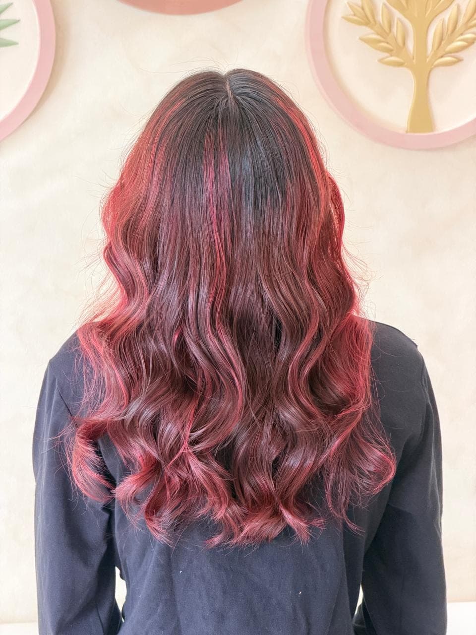 Red balayage curls cascading down — back view