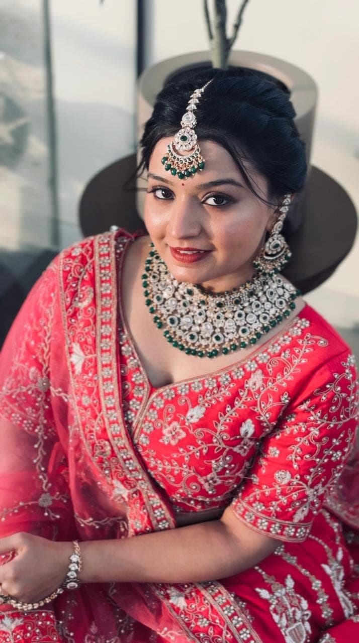 Classic red bridal look with heavy jewellery
