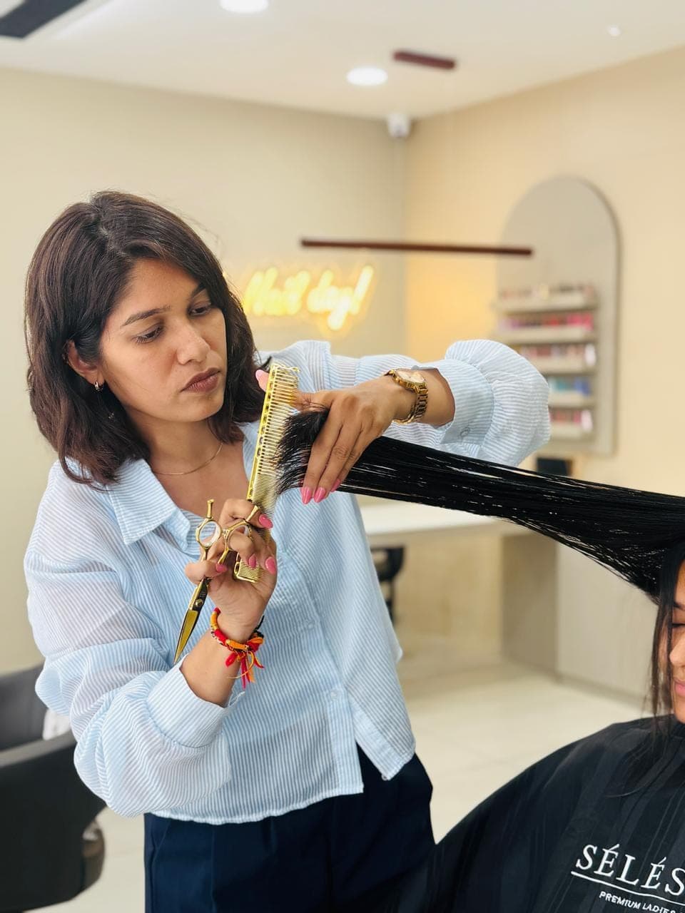 A precision haircut with gold shears at the Selestia atelier, Rajkot