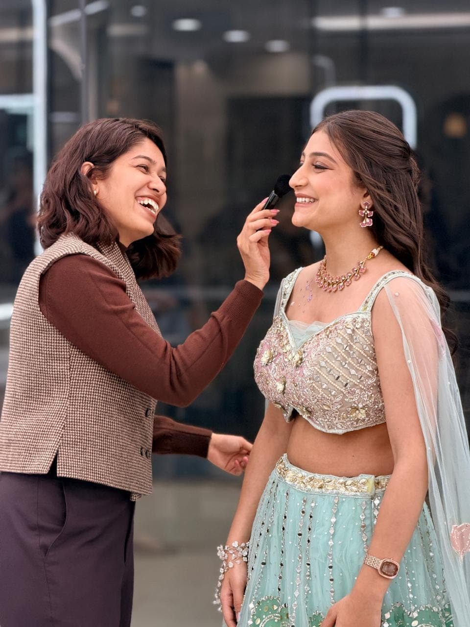Soft-glam party make-up on a client in a mint lehenga at Selestia, Rajkot